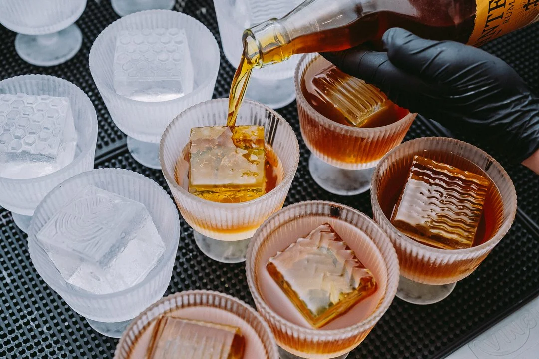 Cocktails being prepared behind the bar