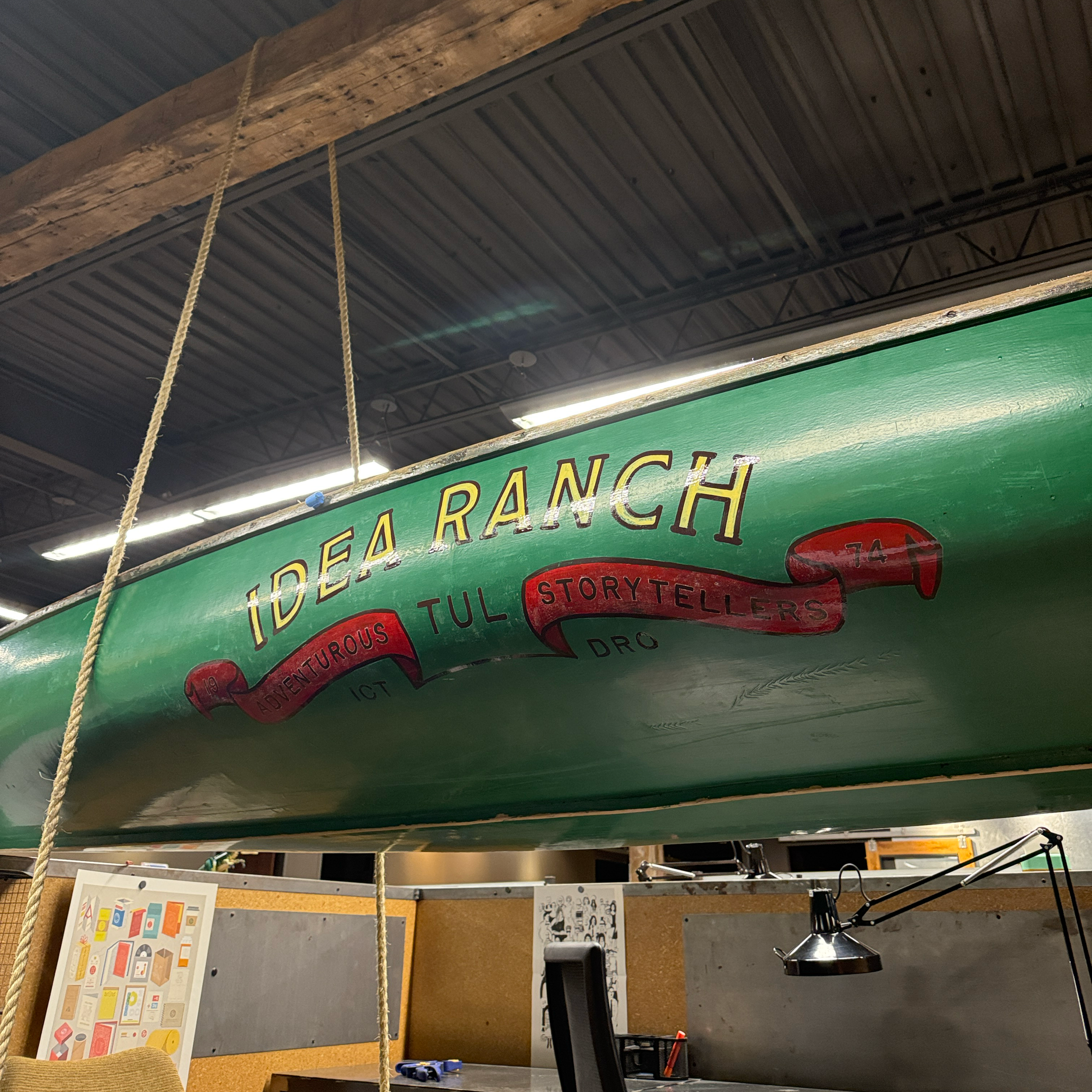 Hand-Painted vintage canoe for Idea Ranch's office space in Tulsa, OK.