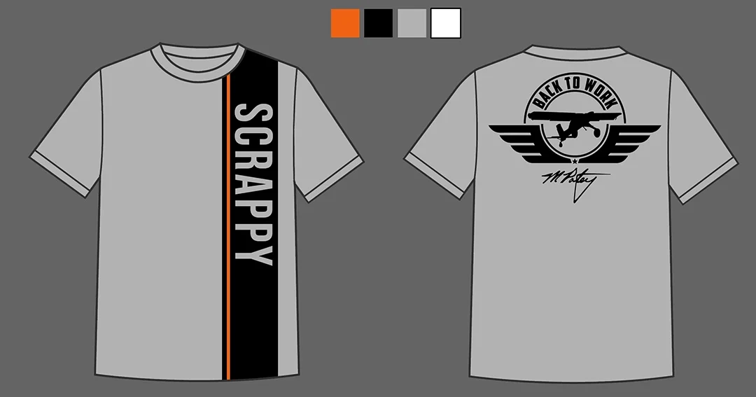 Gray T-shirt with black, orange, and white vertical stripes. The front features the word 'SCRAPPY' in white letters on a black stripe. The back displays a logo with a airplane inside a circle, with the text 'BACK TO WORK' above, and an autograph-style signature below.