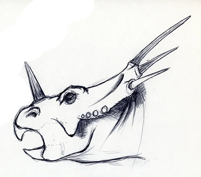 A sketch of a fantastical creature resembling a dragon or dinosaur with a prominent horn on its head, sharp teeth, and spines along its neck.