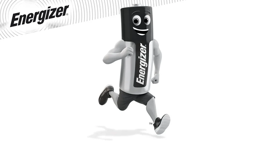 Animated character with a battery body labeled 'Energizer' running with a big smile and expressive eyes, in black and white athletic clothing.