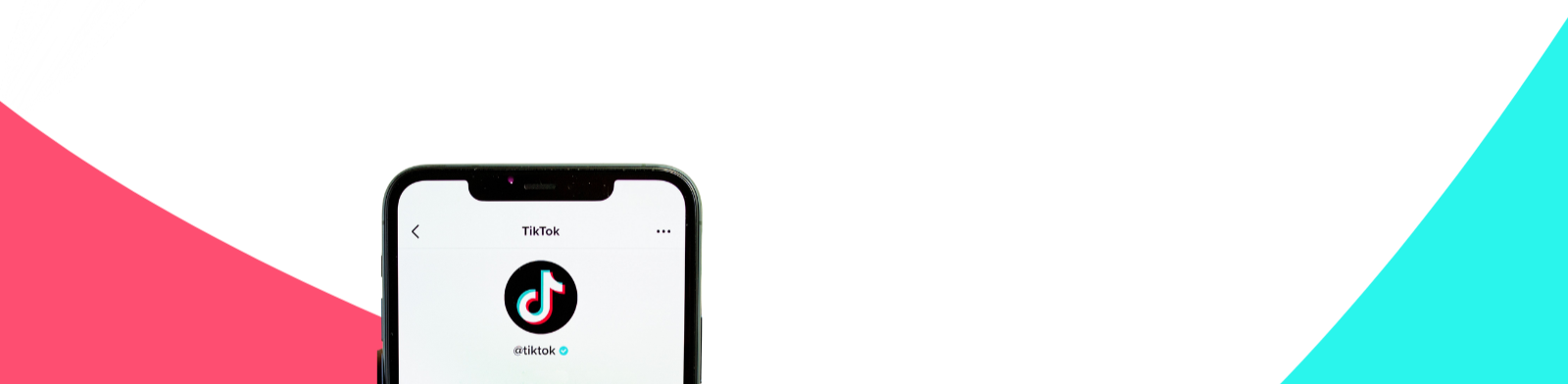 Close-up of a smartphone displaying the TikTok app with the TikTok logo and username