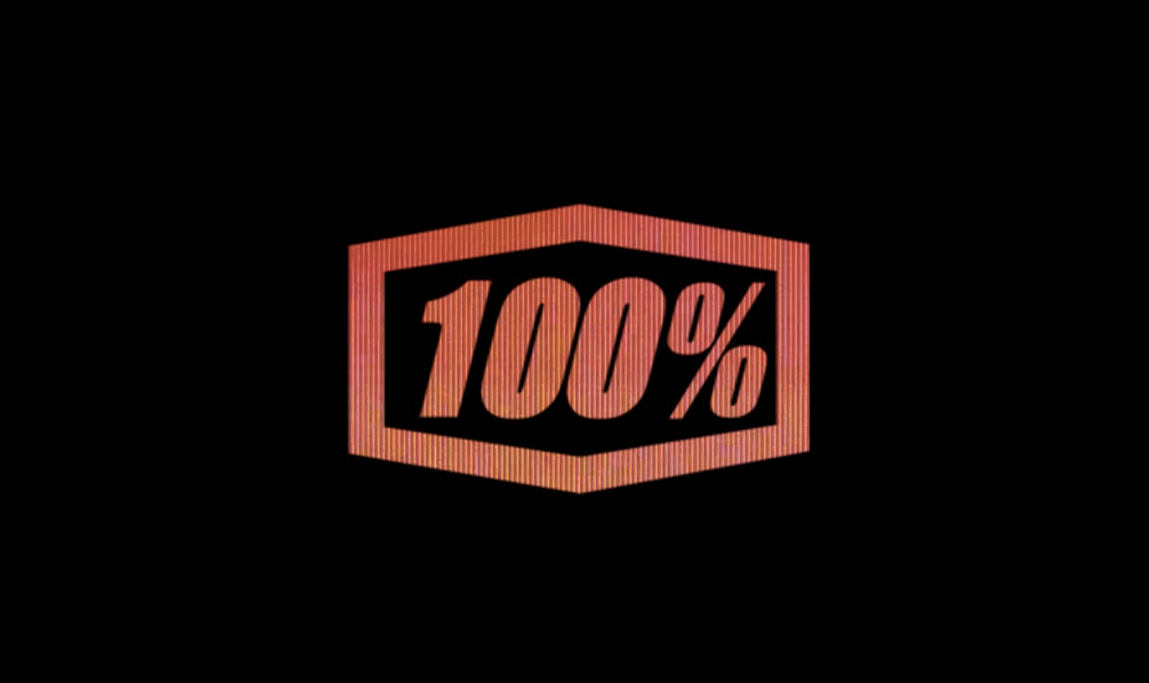 Neon sign displaying "100%" inside a hexagon shape on a black background.