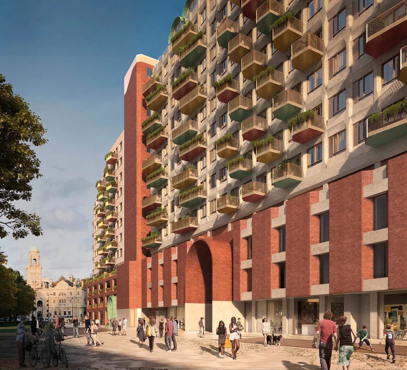 Modern multi-story residential building with balconies, brick facade, and a mixed-use ground floor, with people walking in an urban plaza.