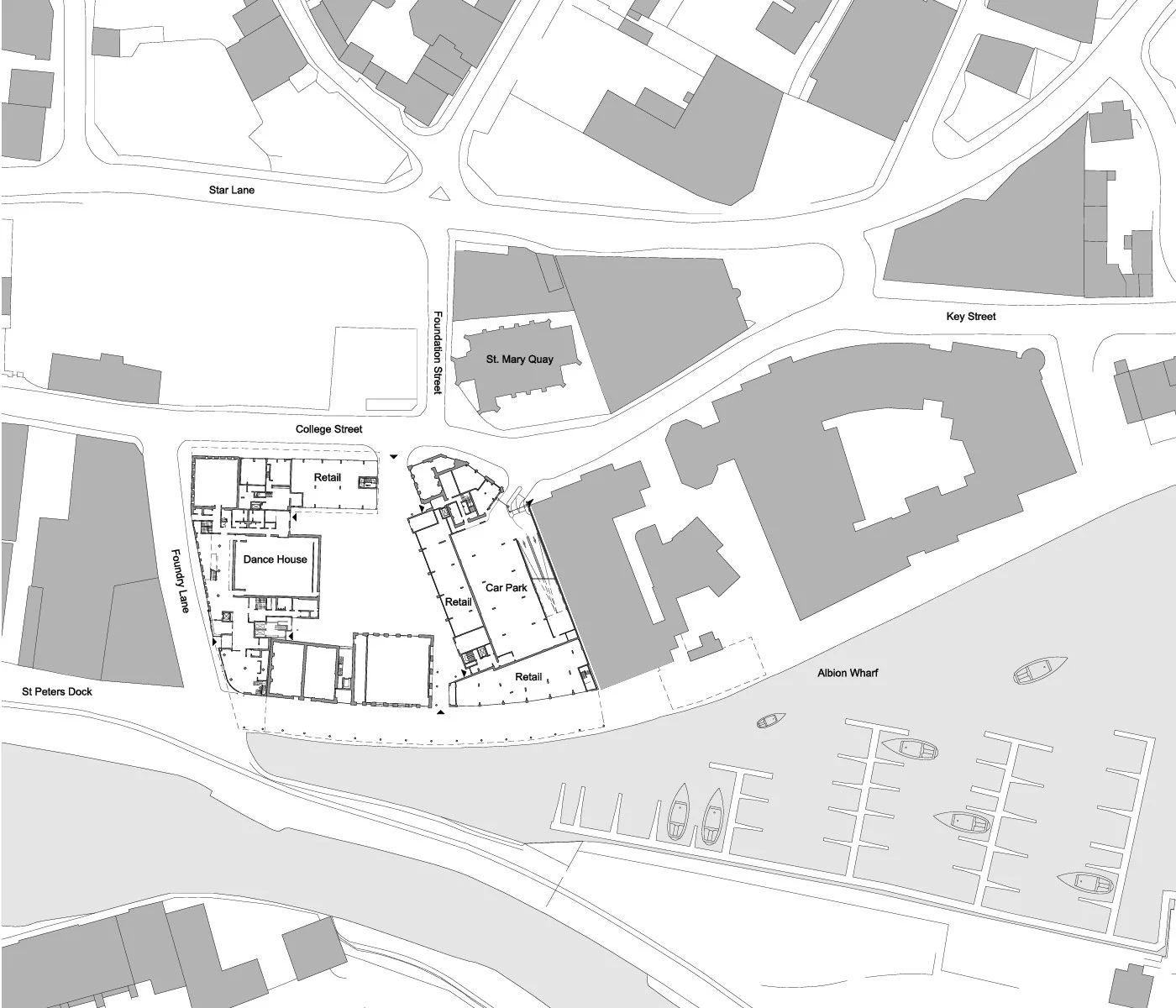 A detailed grayscale map of a waterfront area showing streets, buildings, a dock, and a marina with boats. Streets include Star Lane, Key Street, College Street, Fundy Lane, and Foundation Street. Notable locations include St. Mary Quay, St. Peters Dock, and Albany Wharf. The map also features retail spaces, a dance house, and a car park.