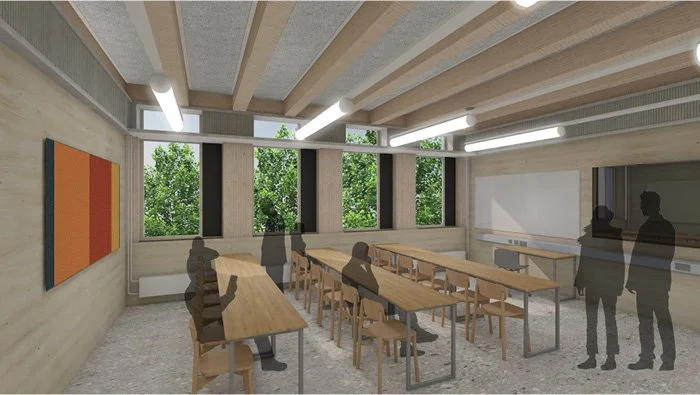 A modern classroom with large windows showing greenery outside, wooden desks and chairs, and a whiteboard at the front.