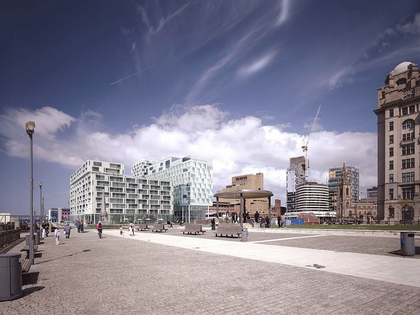 A realistic computer render of the New World Square  multi-story modern building in Liverpool the dock promenade in the foreground with benches and people walking on paved pathways under partly cloudy sky.