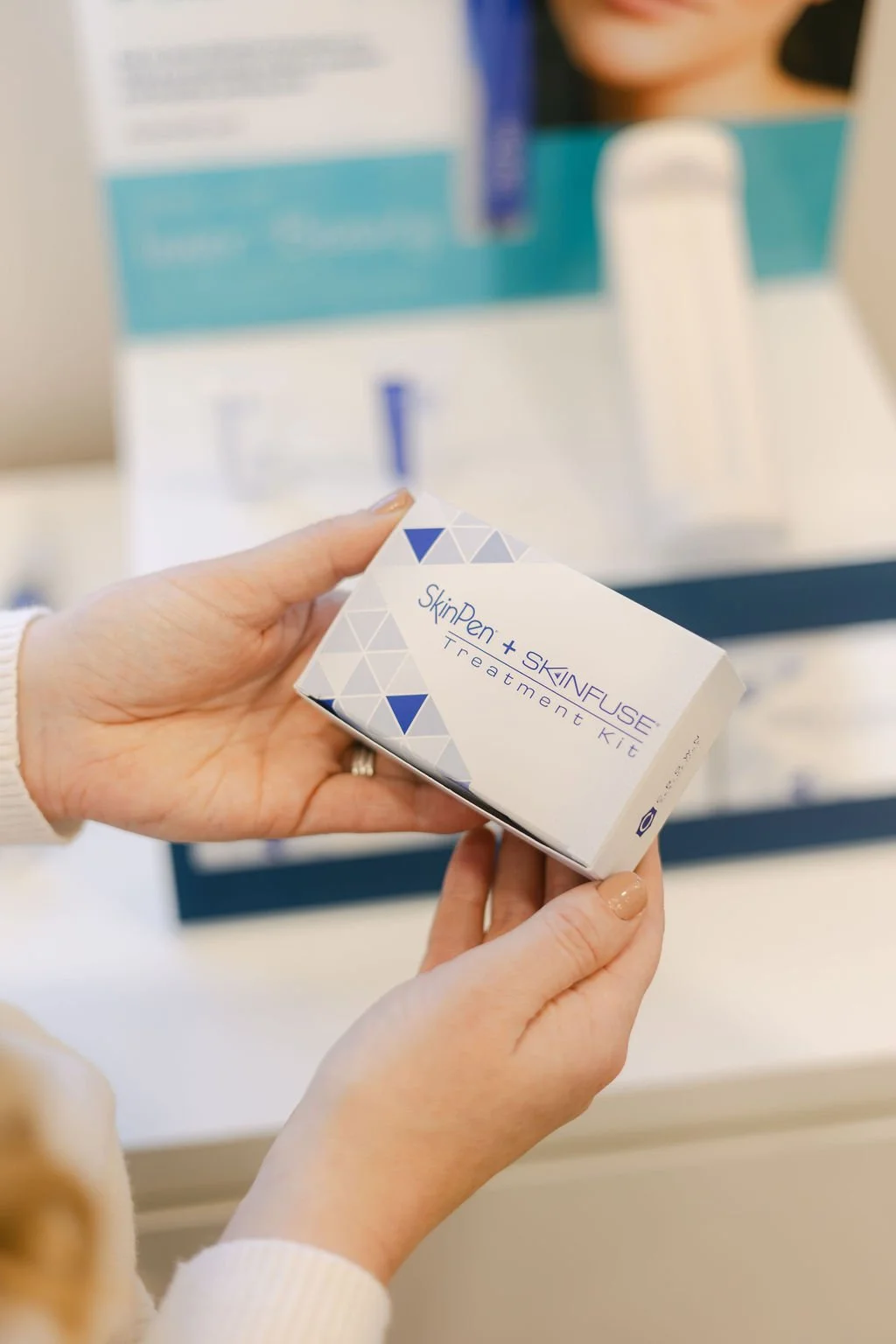 Skinpen treatment kit held by an aesthetics practitioner.