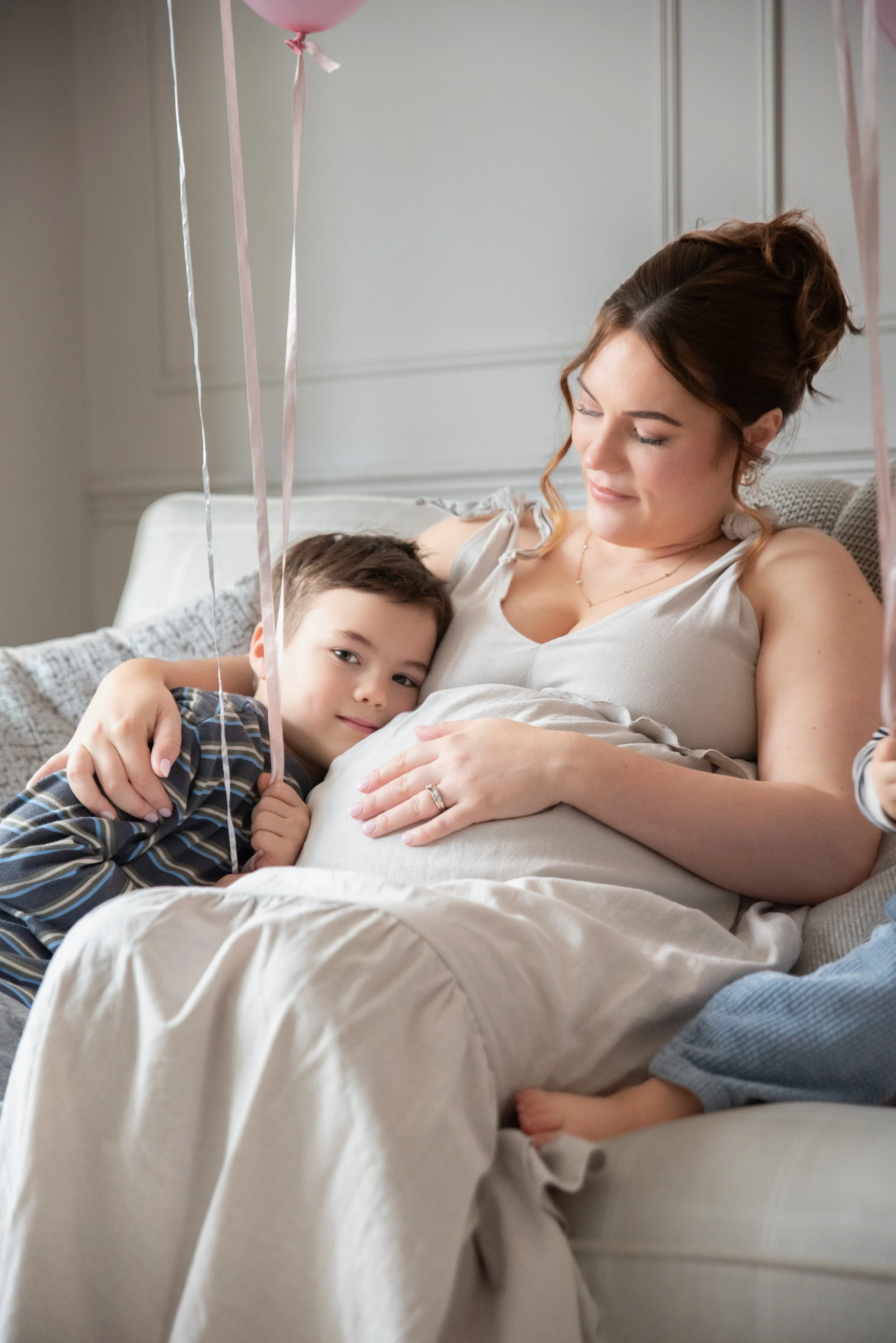 Pregnant mom with older siblings home photo shoot in Sutton Coldfield