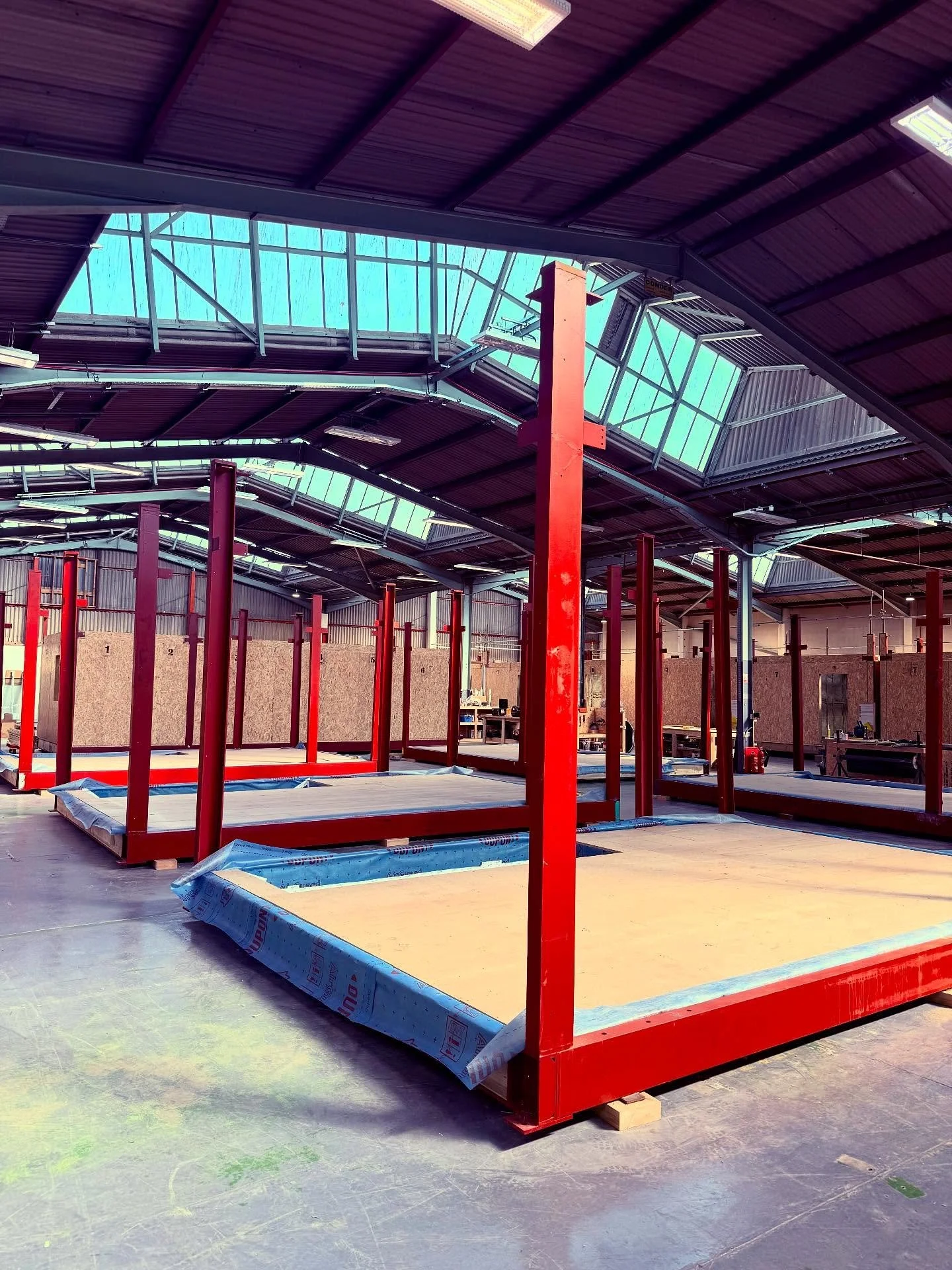 Deep in the wilds of the warehouse savannah, the mighty red steel frame begins its majestic migration from fabrication to formation. Standing tall and proud, these beasts of British engineering&mdash;primed in their signature red oxide&mdash;await th