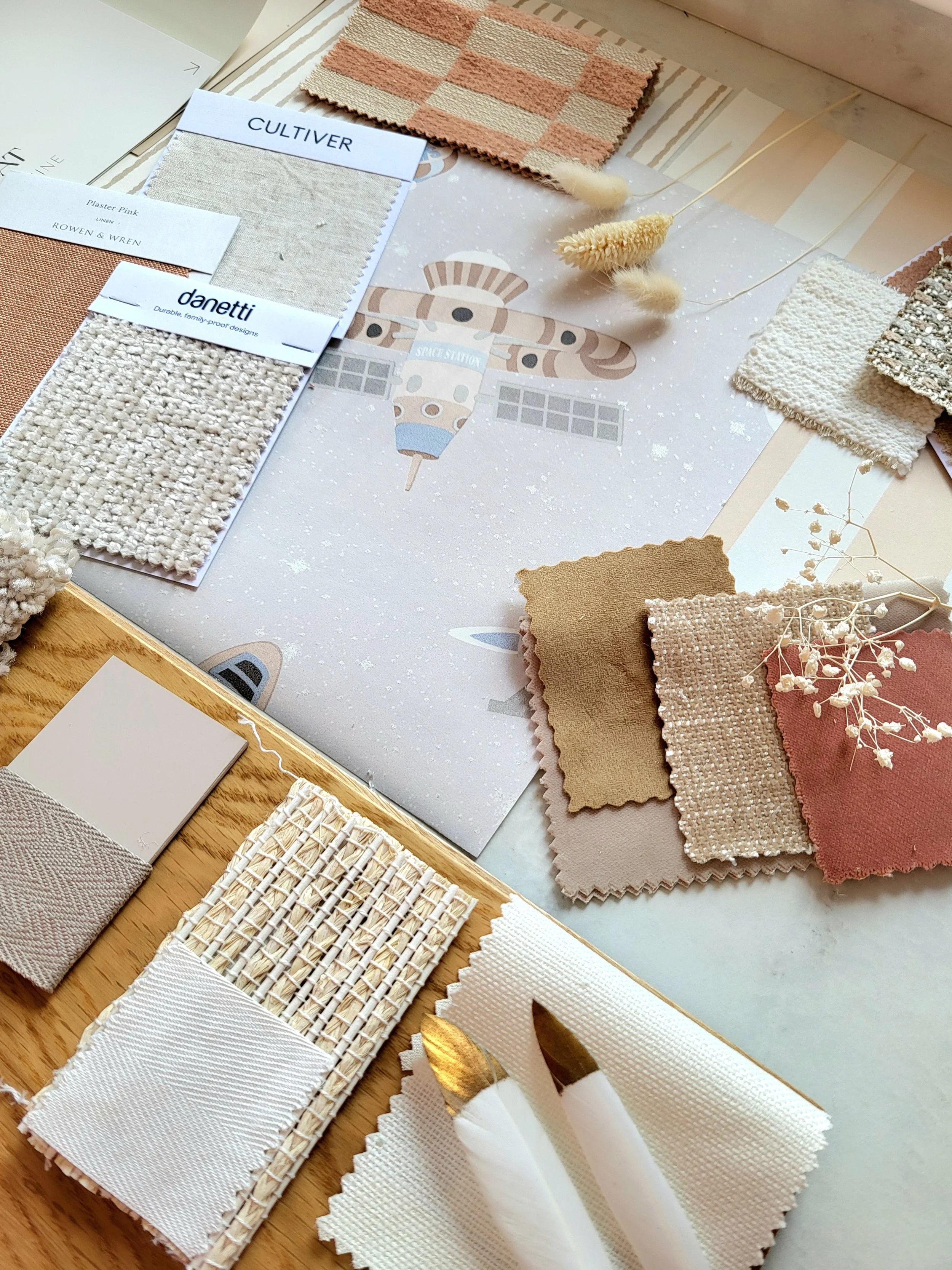 Nude and pink colour palette for babys nursery with wallpaper, paint, fabric swatches and samples. Carpet & flooring samples.