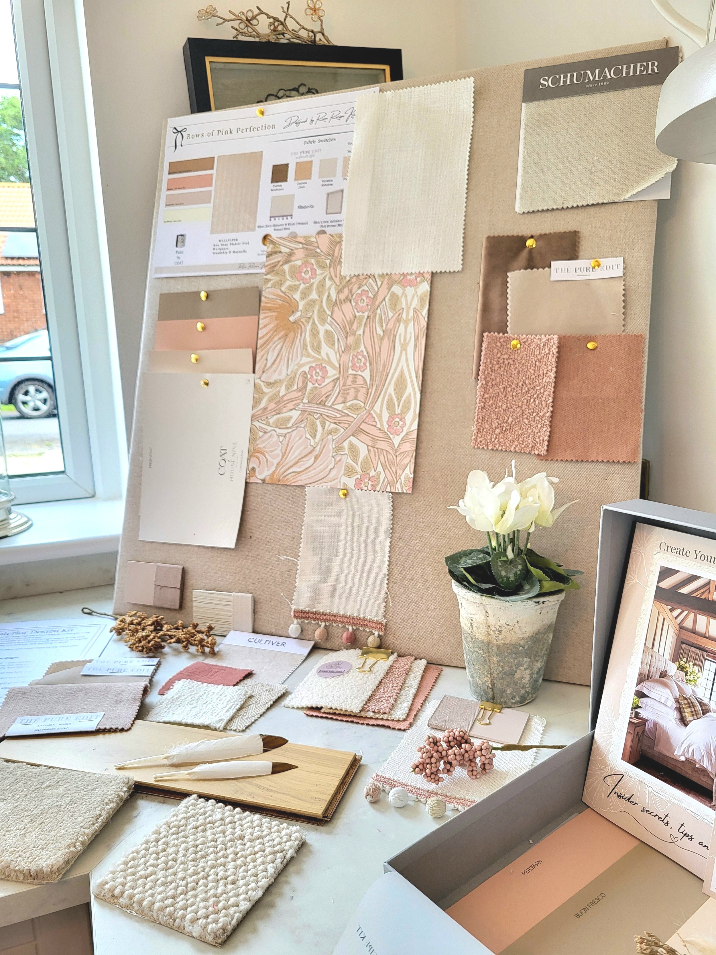 Nude and pinky peach colour palette with wallpaper, paint, fabric swatches and samples. Carpet & flooring samples.