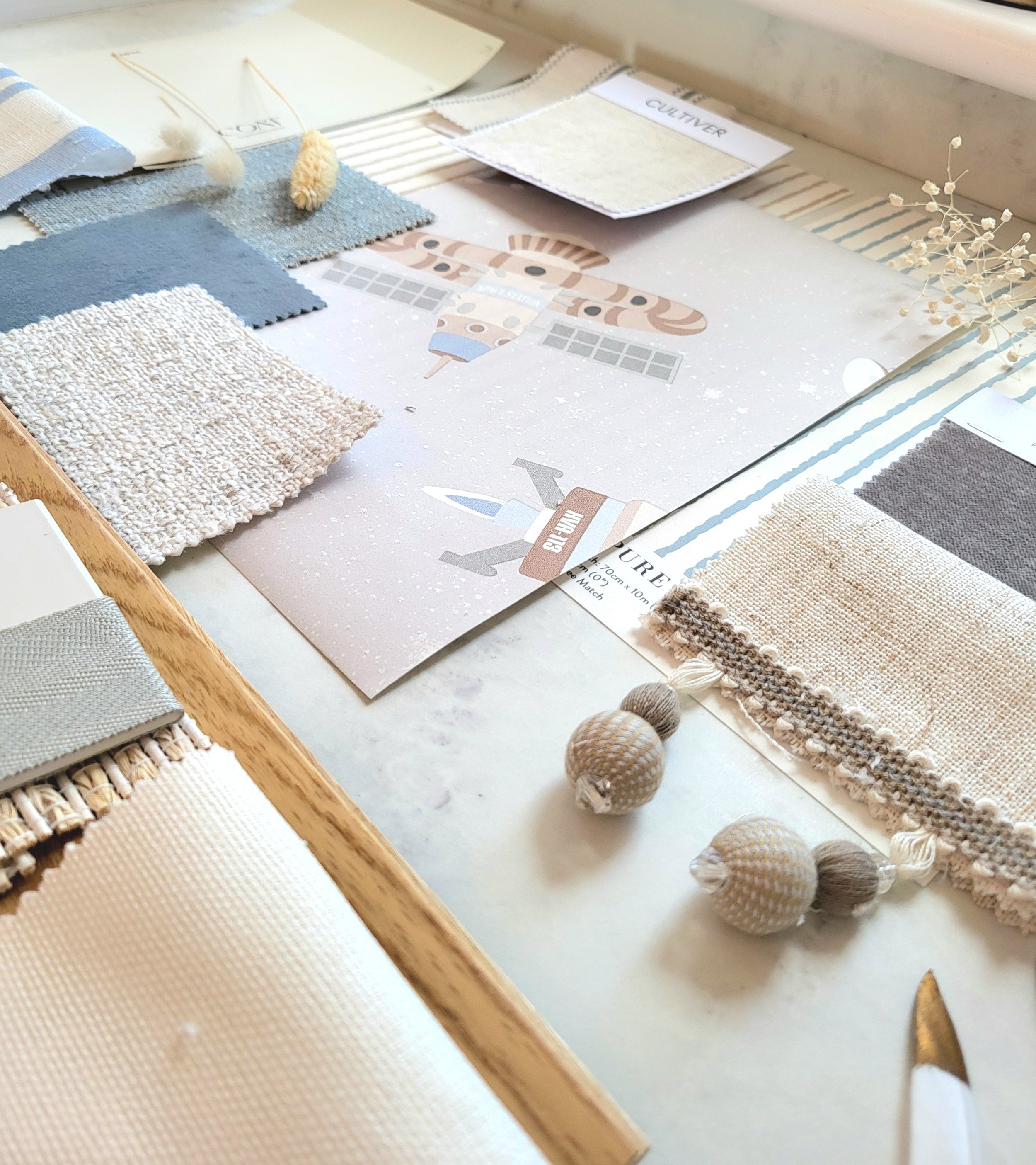 Nude, Blues & Bluey Greens colour palette for babys nursery with wallpaper, paint, fabric swatches and samples. Carpet & flooring samples.