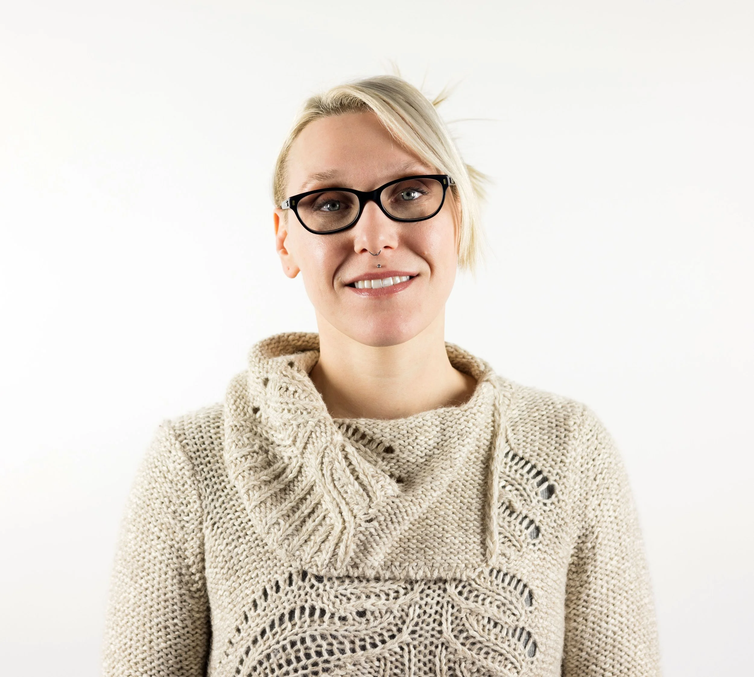 headshot of caucasian woman with blonde hair and glasses