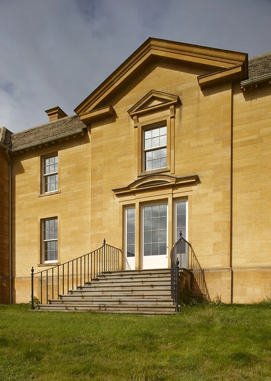 Traditional country house entrance with stone staircase by Craig Hamilton Architects