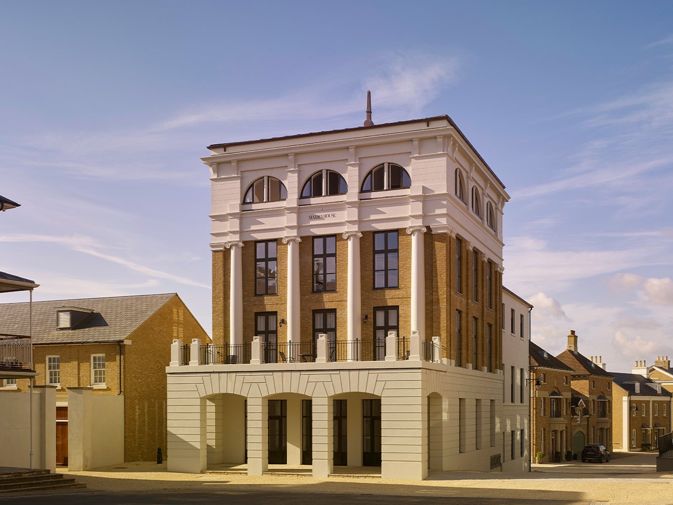 Corner elevation of a classical mixed-use building at Poundbury, Dorchester, Dorset.