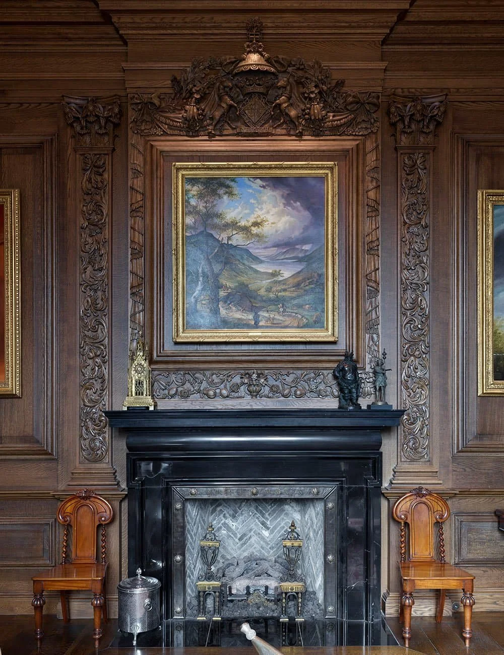Classically detailed interior with carved timber panelling and fireplace at Freedom Place, Old Parkland, Dallas.