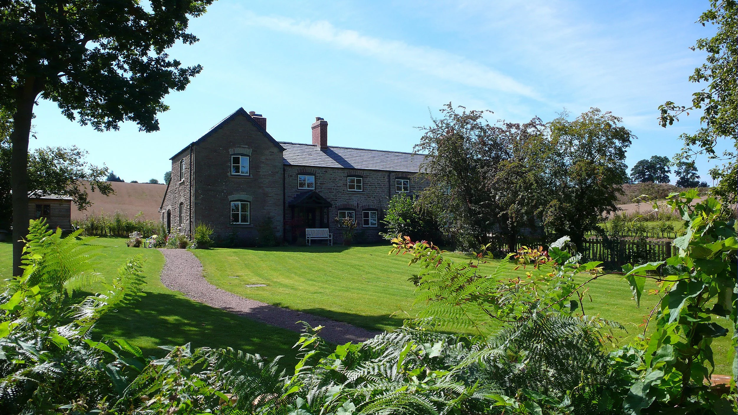 Traditional stone country house at Harewood End, Herefordshire, designed for the Duchy of Cornwall.