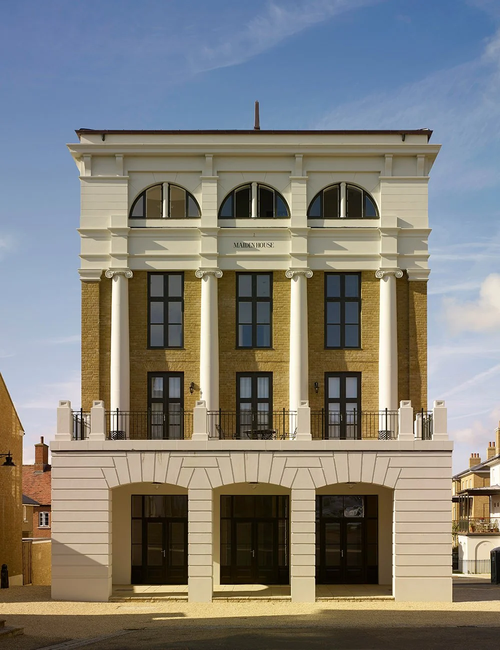 Front elevation of a classical commercial and residential building at Poundbury, Dorchester, Dorset.