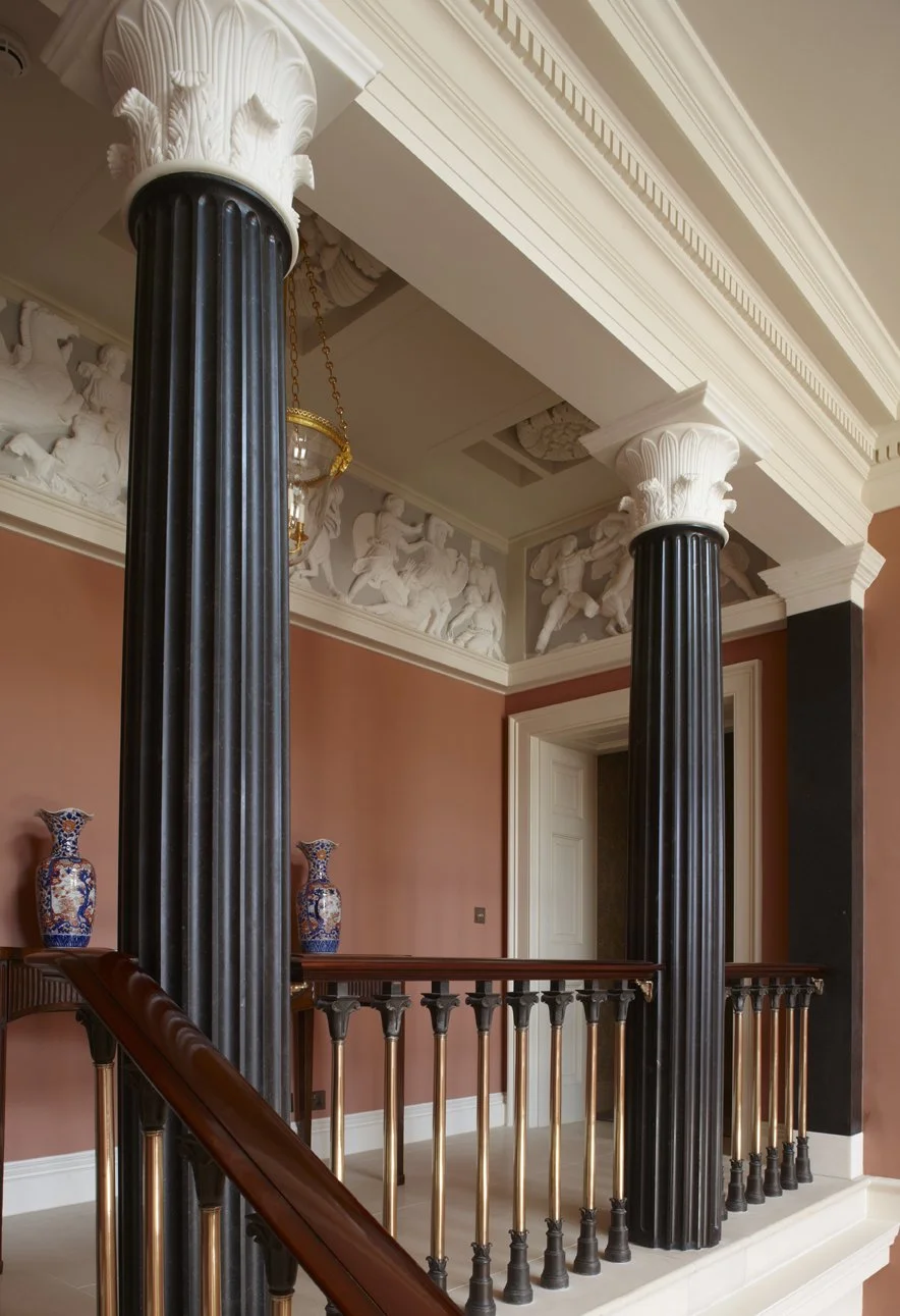 Classical column and staircase detail with sculptural frieze by Craig Hamilton Architects