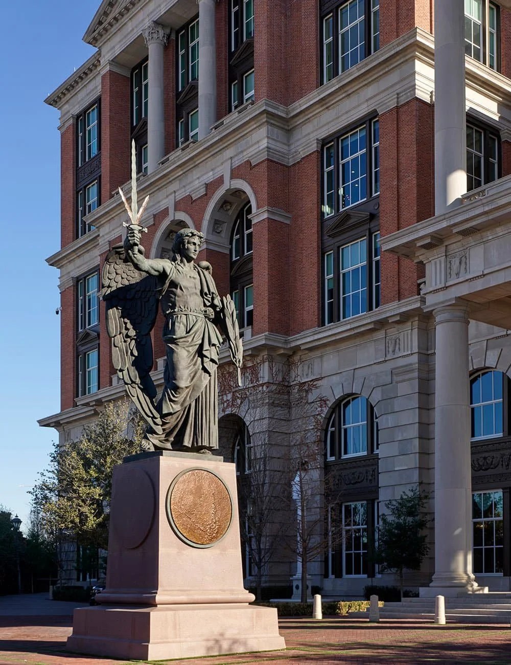 The Angel of the Categorical Imperative bronze statue by Alexander Stoddart beside the entrance to Freedom Place, Old Parkland, Dallas.