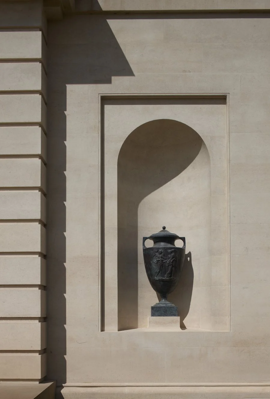 Classical stone niche with urn detail at Gloucestershire country house by Craig Hamilton Architects