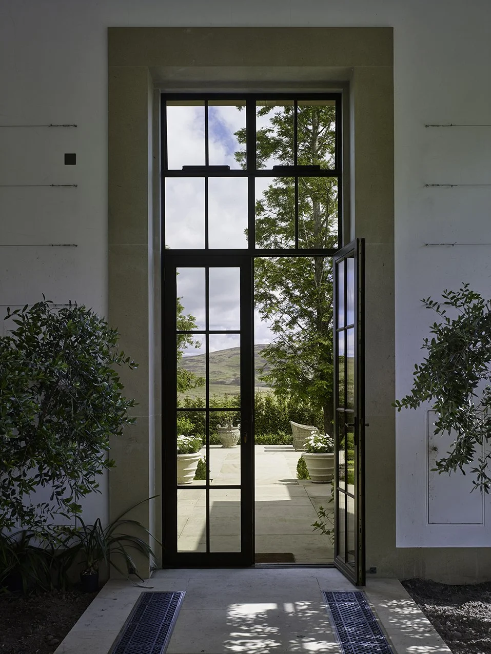 View from inside the orangery towards the entrance and formal garden beyond.