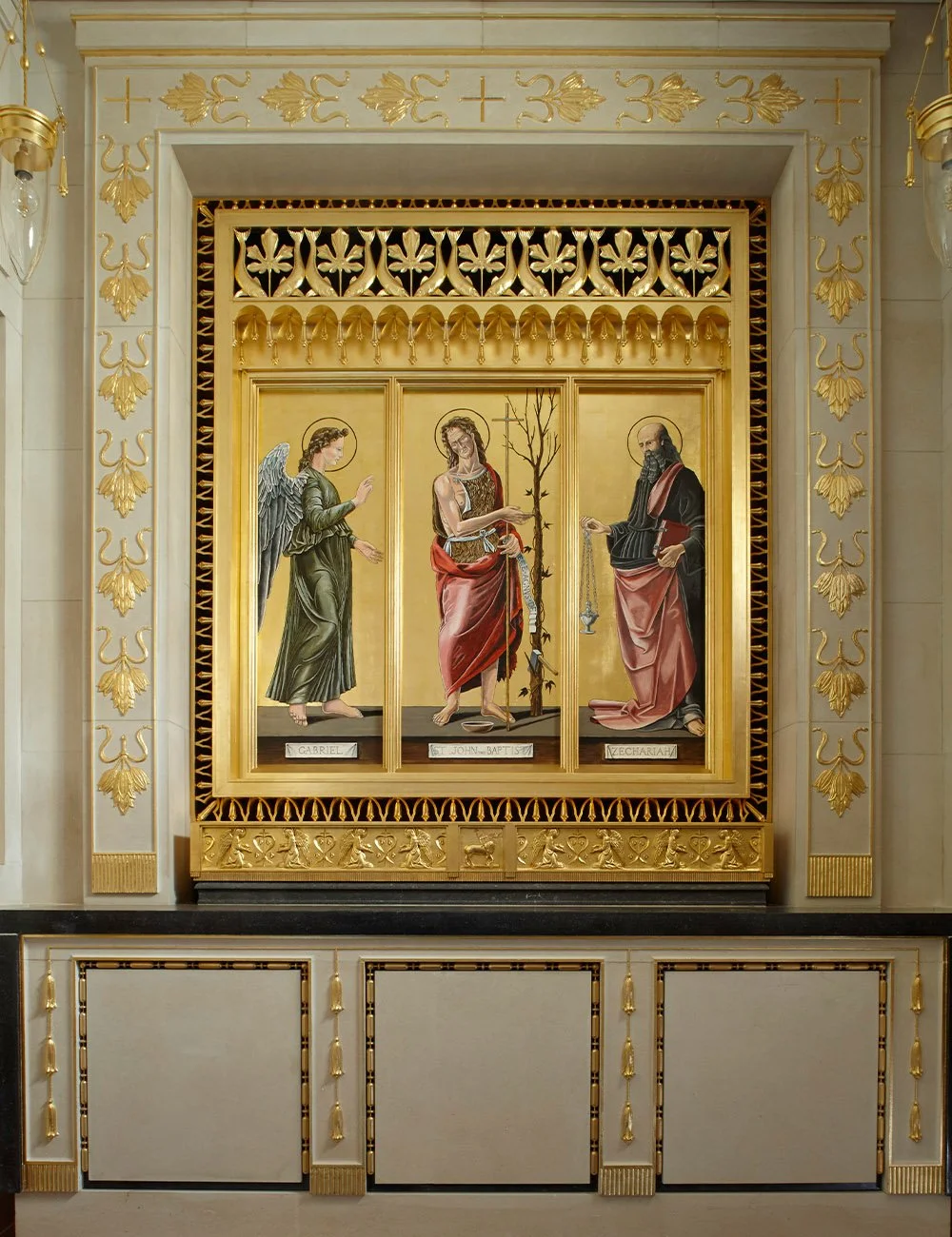 Religious artwork and gilded decorative detailing inside The Chapel of Christ the Redeemer at Culham.
