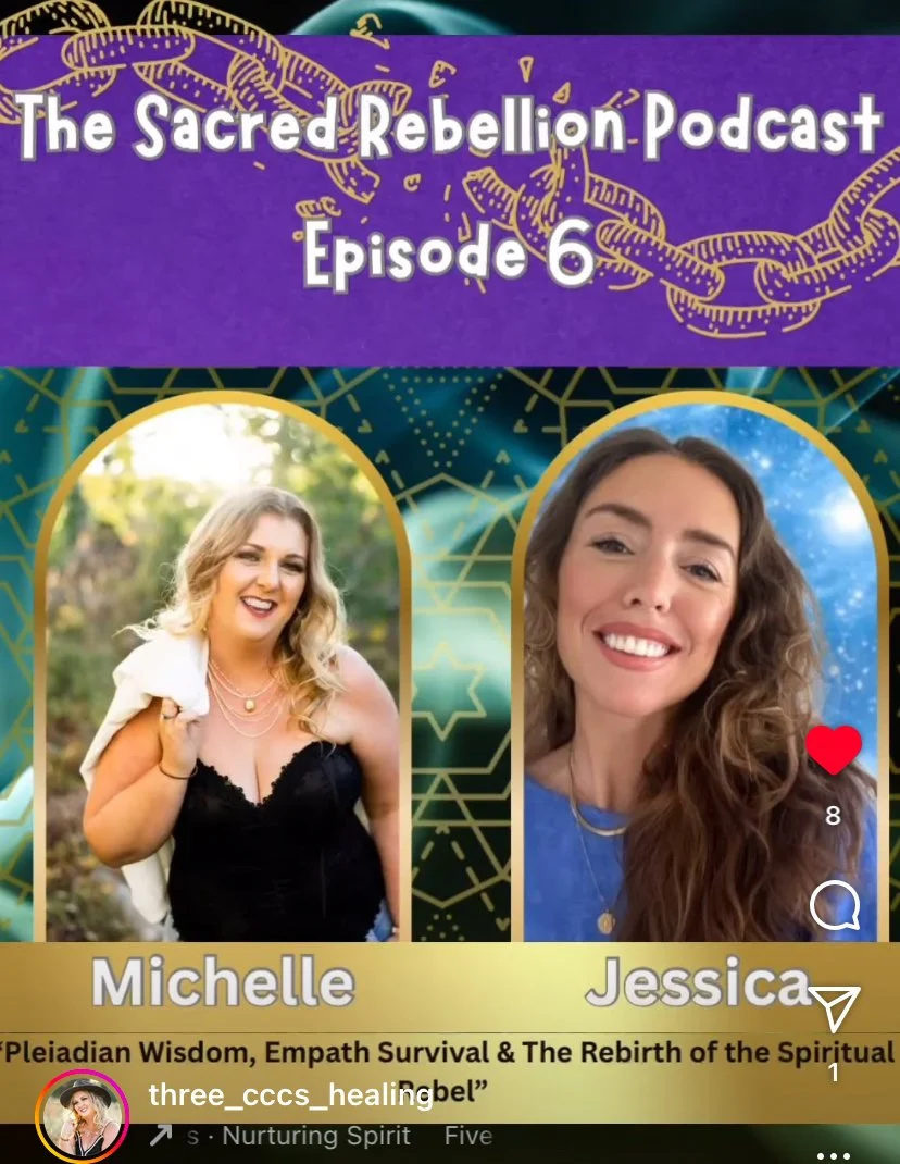 Woman with long hair in a patterned shawl stands against a pastel abstract background with light bokeh effects.