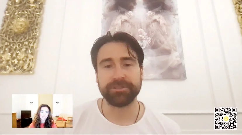 Woman with long hair and eyes closed in a meditative pose against a dreamy, cloud-filled background with light bubbles.