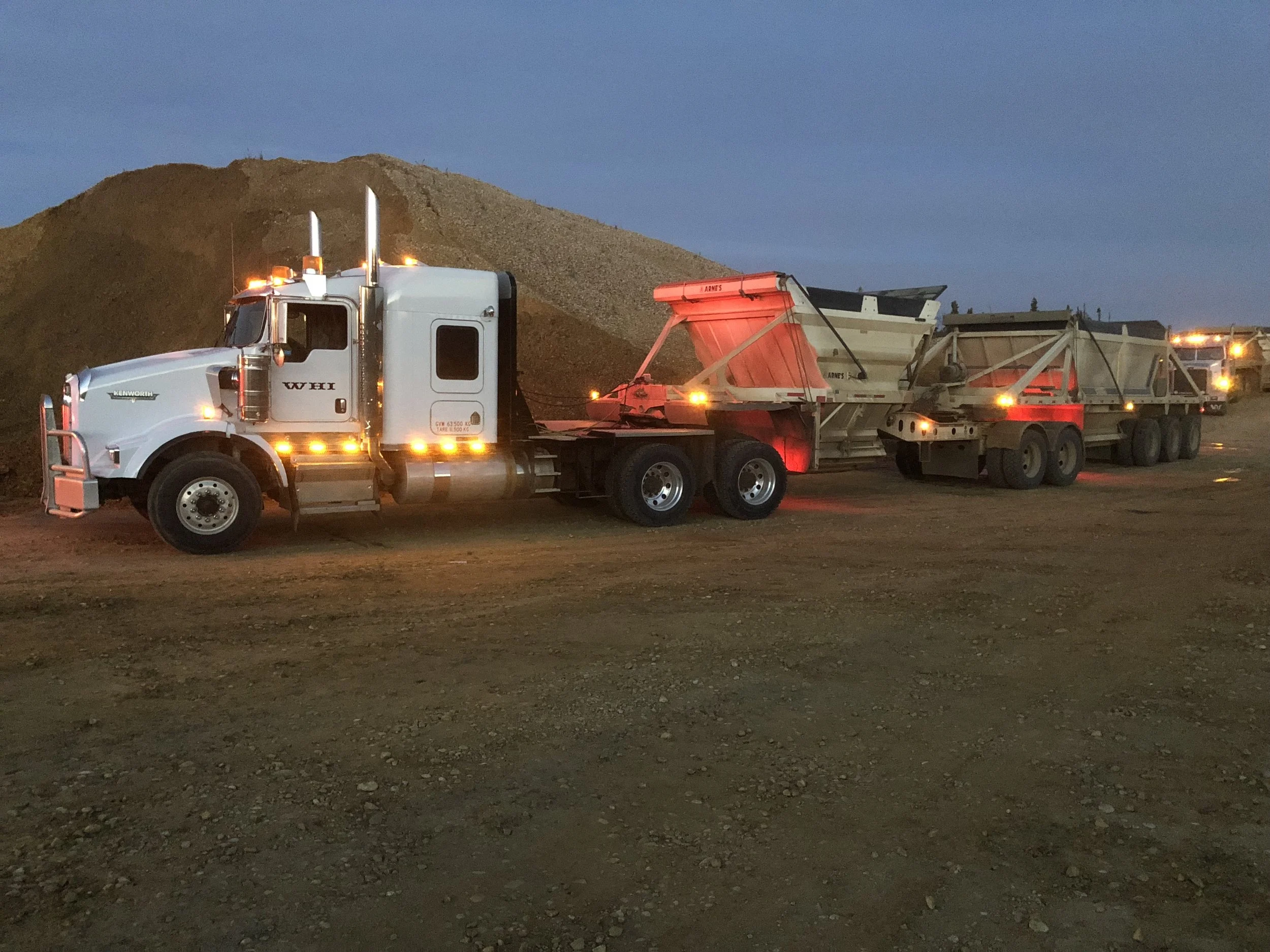 Willowhill Holdings Inc truck delivering gravel to a construction site
