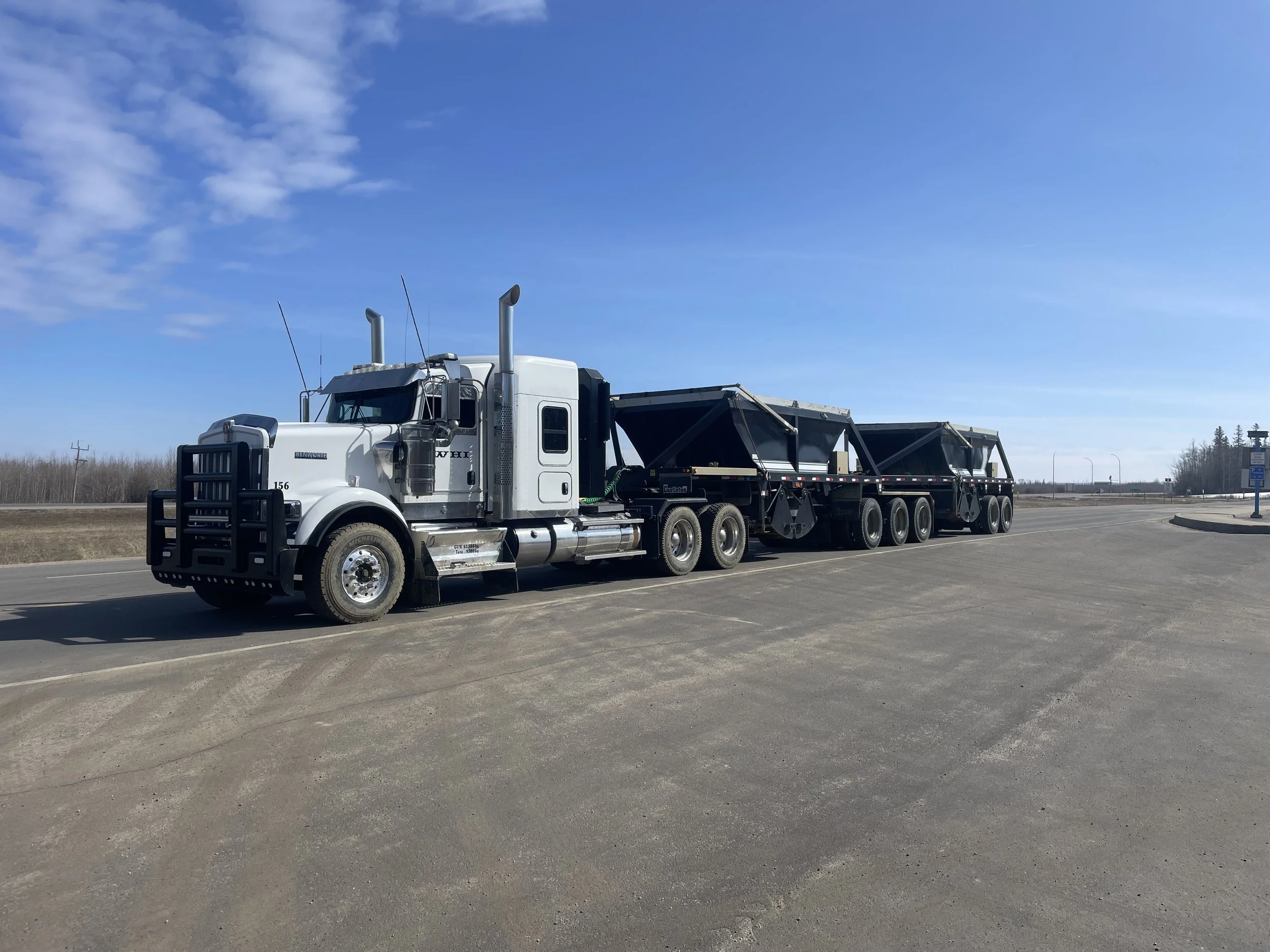 Truck from Willowhill Holdings Inc transporting contaminated soil safely under TDG regulations