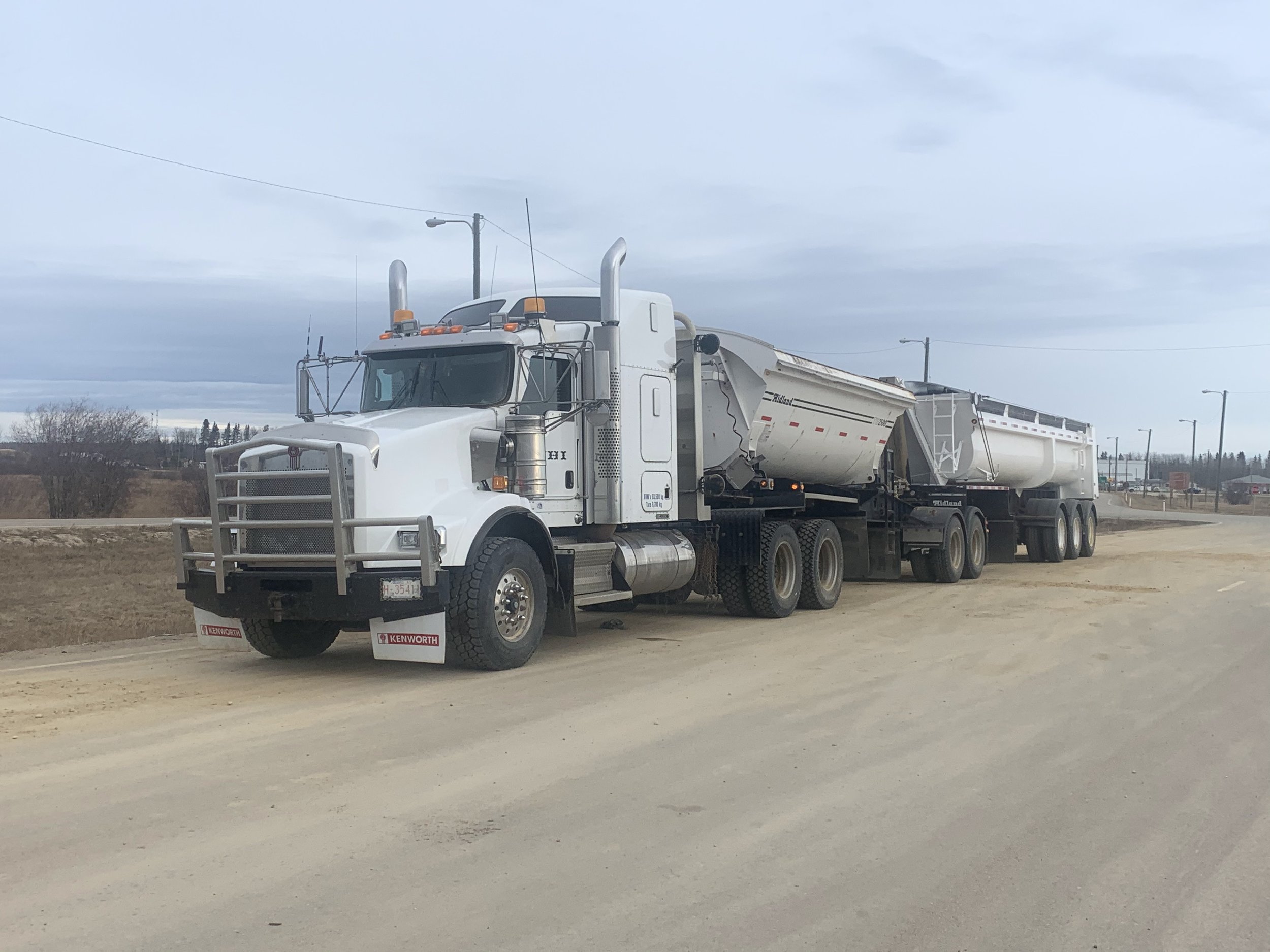 Close-up of Super B Clams and Tridem Clams trucks ensuring secure load transport