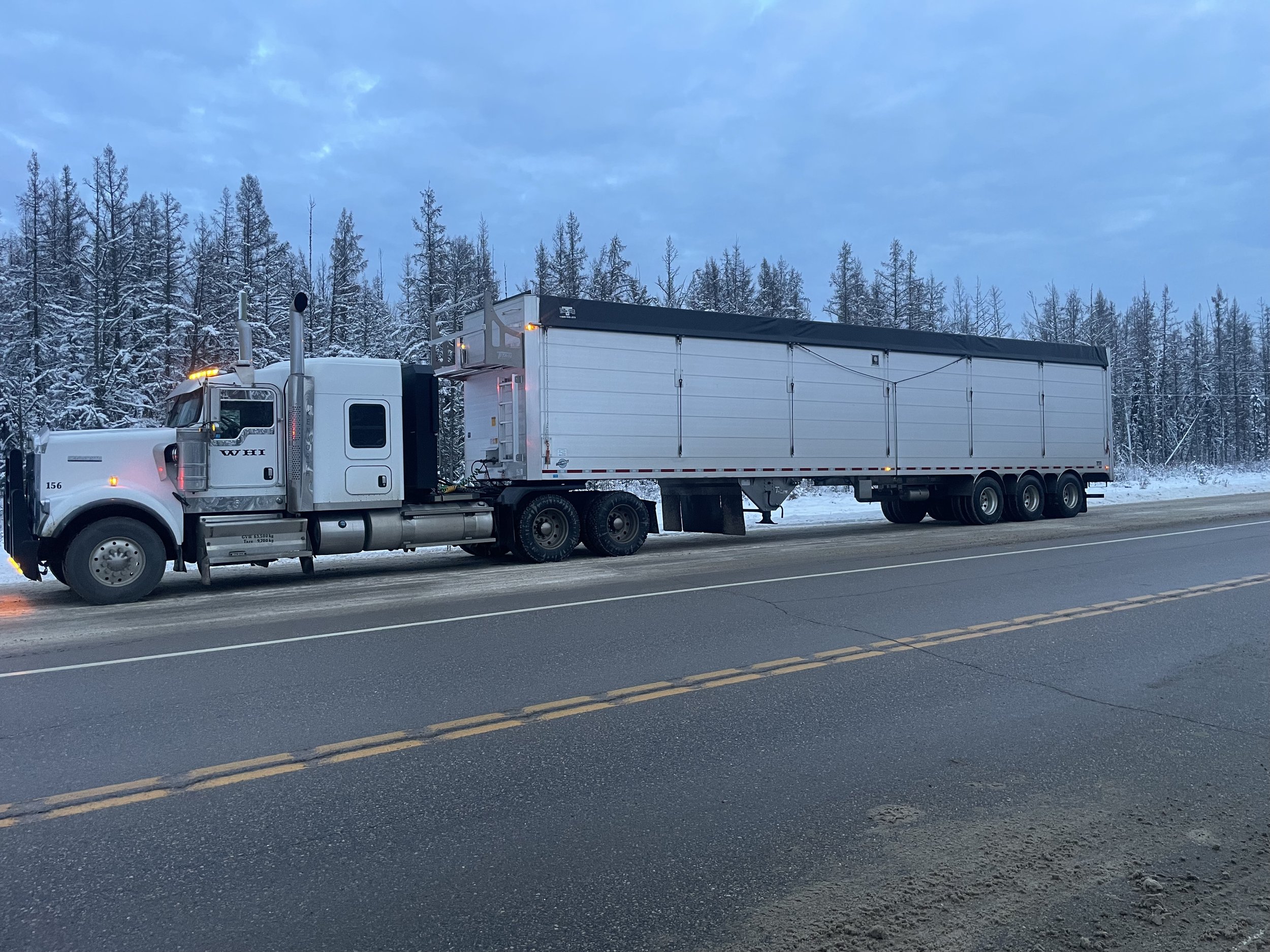 Close-up of Super B Clams and Tridem Clams trucks ensuring secure load transport