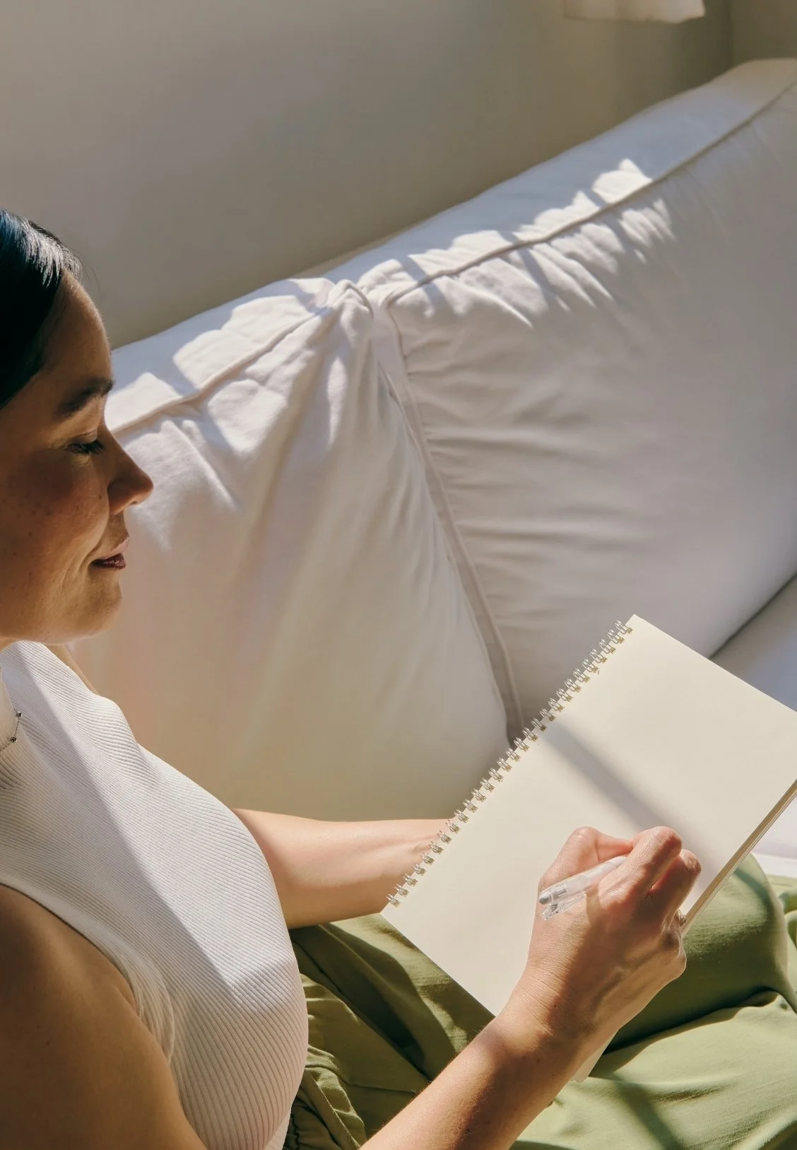 a woman reflecting in her journal