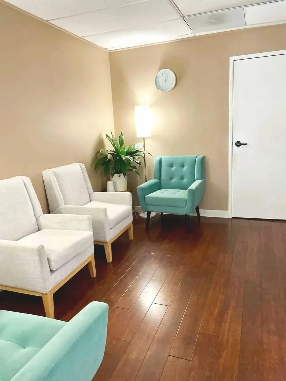 Bright therapy office with comfortable seating for in-person counseling sessions in Brea, California.