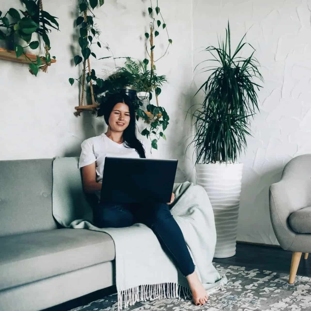 Woman attending an online therapy session from a peaceful home environment in California.