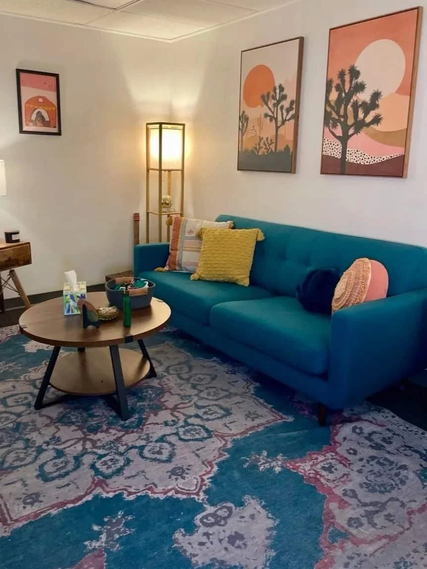Warm and inviting therapy office with couch and seating area for adult therapy sessions in Brea.