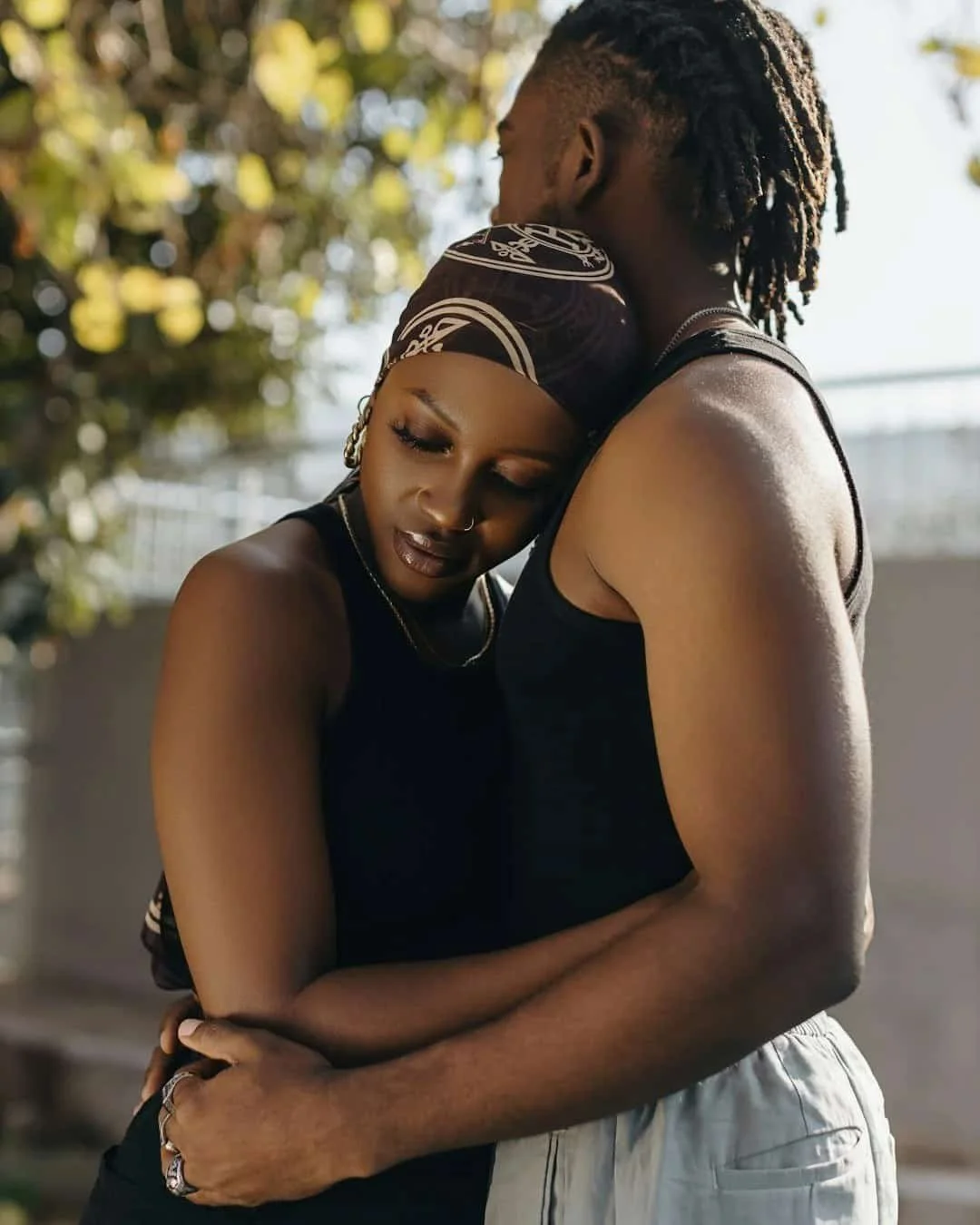 Couple hugging closely, representing emotional connection, relationship triggers, and vulnerability in intimate relationships.