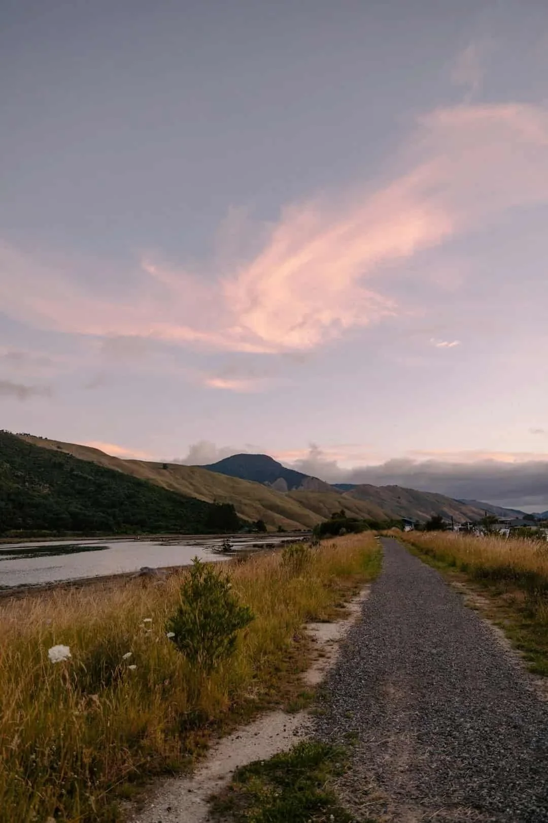 Open path through a quiet mountain landscape representing space for reflection during therapy intensives