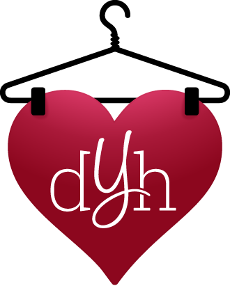 A burgundy shopping bag with black handles and white reverse text. It's upside down, displaying 'Happy New Year'.