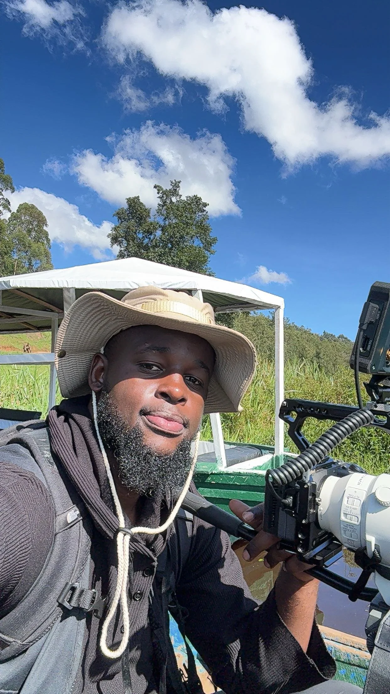 James Rooney selfie with a long lens in the field