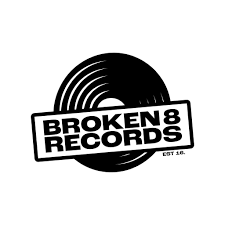 Logo of Broken 8 Records featuring a stylized vinyl record with the company name on a banner across it.