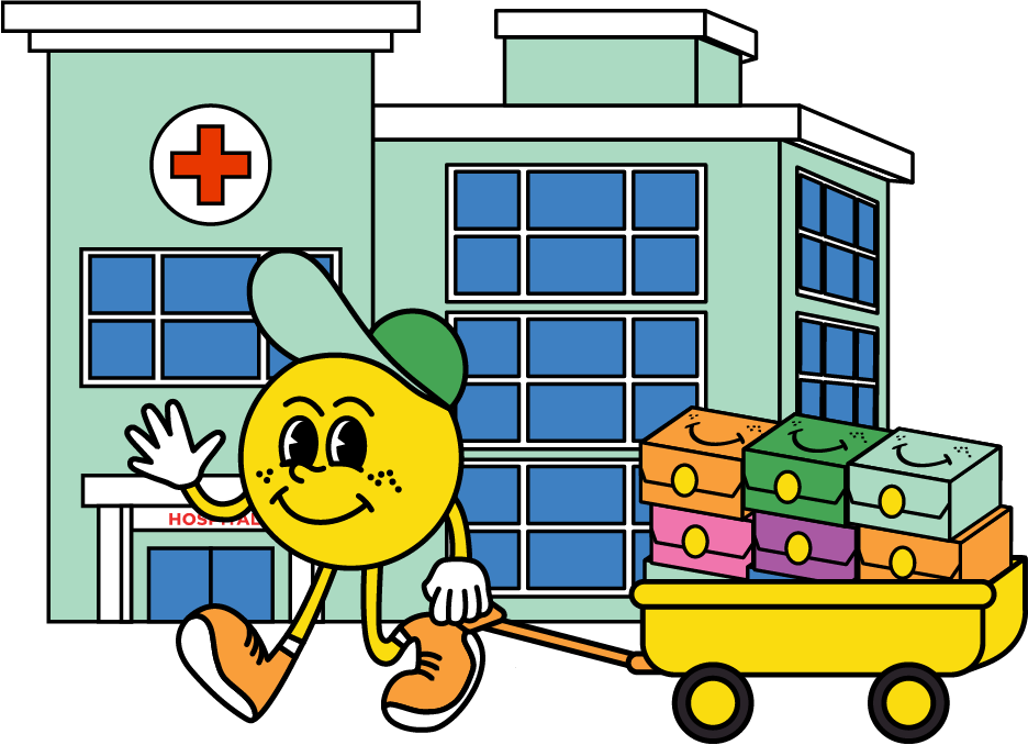 Illustration of a smiley face character wearing a cap, pulling a yellow cart with gift boxes in front of a hospital building. Felix Farmhouse building Smile Boxes for Smile Club Members at Children's Hospitals