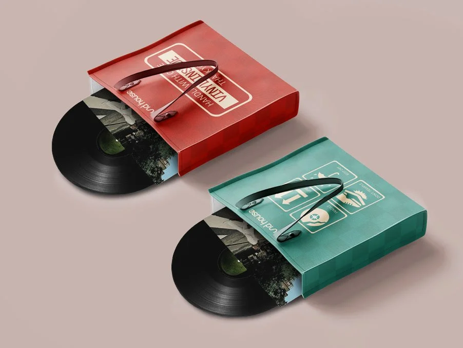 Red and green gift bags with vinyl records partially inside