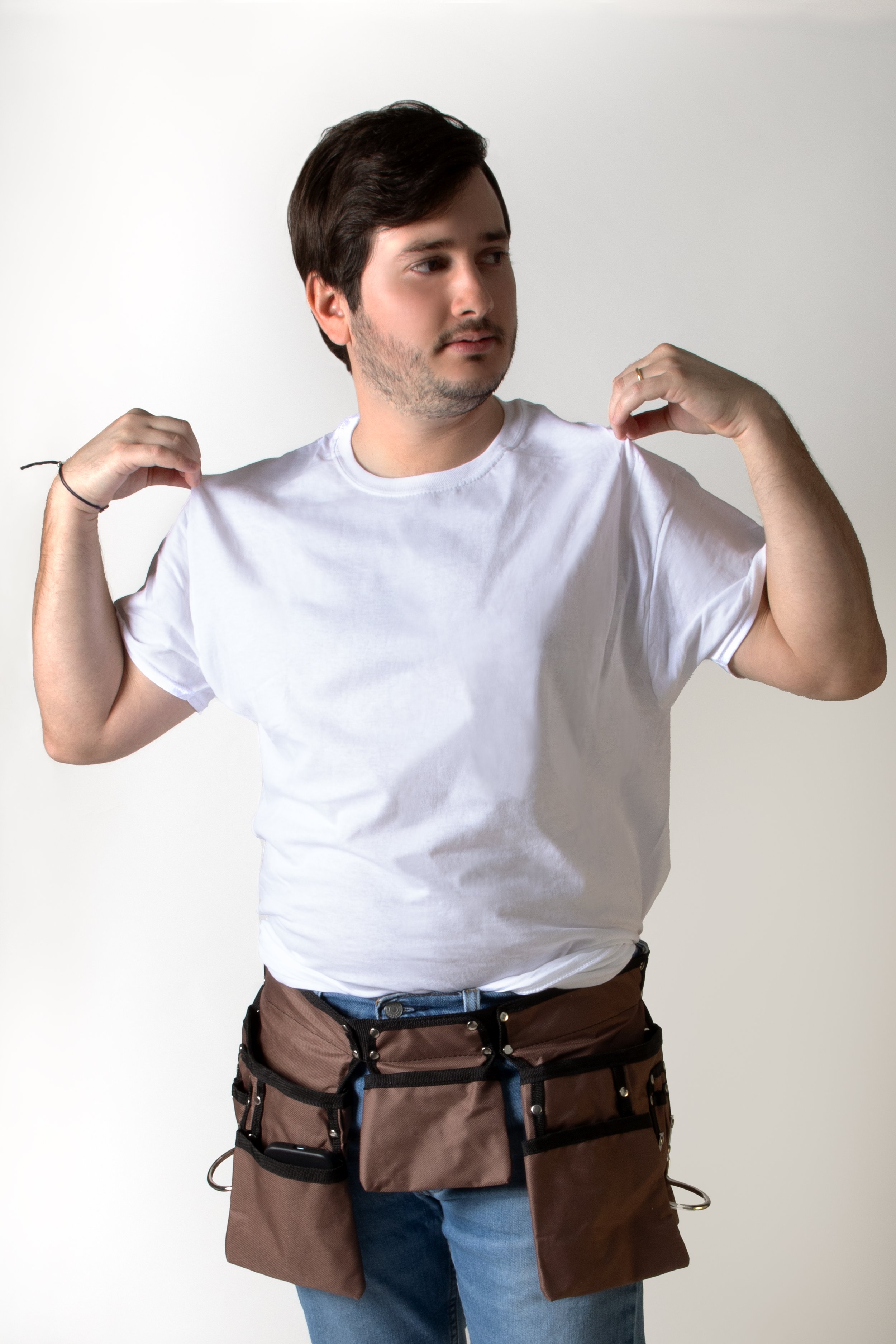 Person in white T-shirt wearing a tool belt