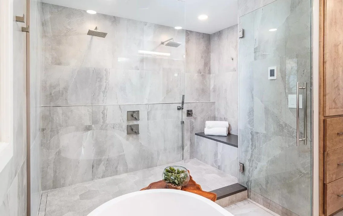 This double shower is all about calm, comfort and quiet luxury. With the full width niche shelving, neutral finishes and natural light Step into serenity. 

 #mninteriordesign #interiordesign #design #karvonendesignstudio #details #InteriorDesign #mn