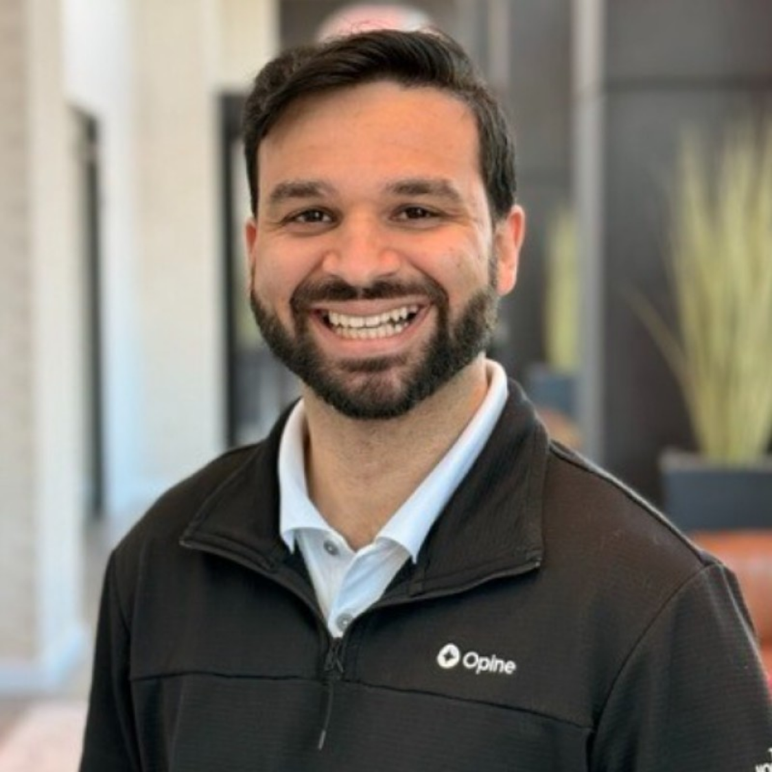 Headshot of Opine CEO Akash Ganapathi