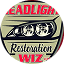 Close-up of a car's headlight with a sticker reading 'Headlight Restoration'.