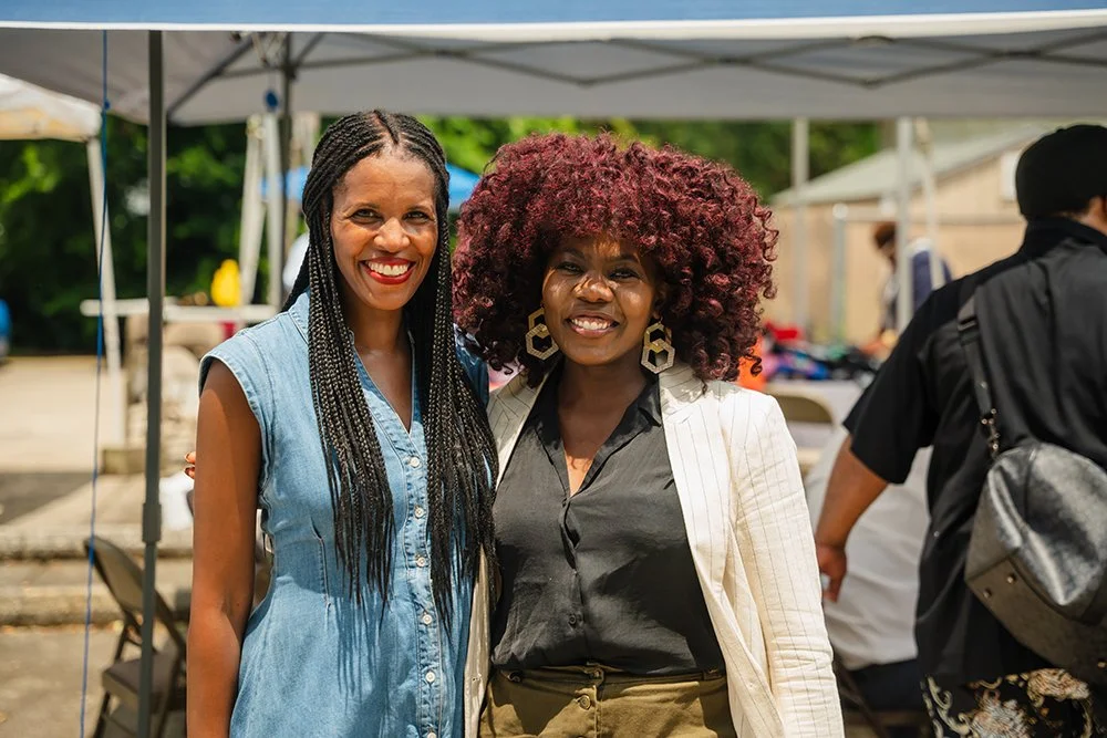 Co-Organizers Candice Fortin of 350 and Abre' Conner of NAACP at the post-sermon reception and mutual aid distribution.